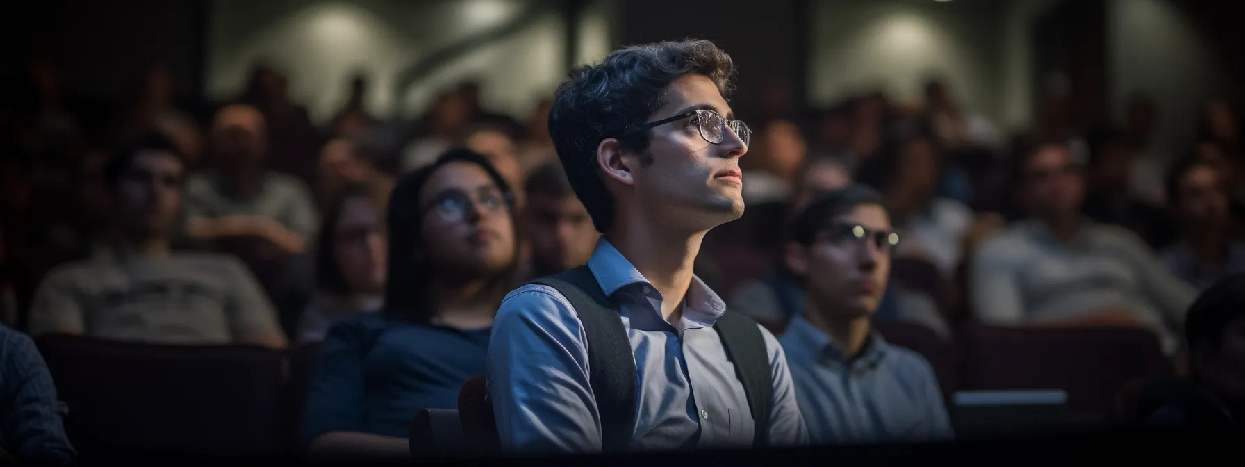 a person attending a seotheory class, listening attentively to manick bhan's lecture on optimizing seo strategy with keywords.